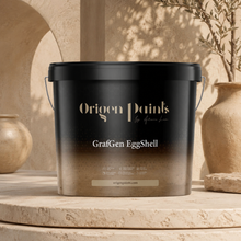 Black paint bucket labeled 'Origen Paints' on a rustic background with decorative vases and plants.