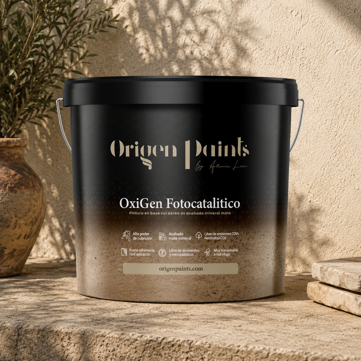 Black paint bucket labeled 'Origen Paints' on a stone surface with a plant in the background