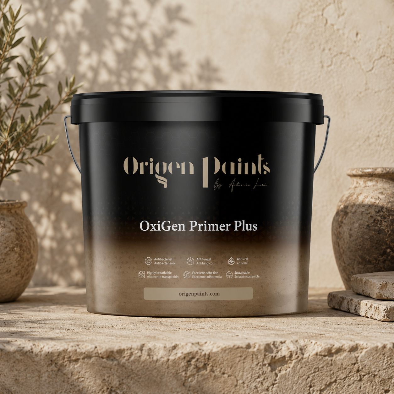 Black container of Origen Paints OxiGen Primer Plus on a stone surface with plants in the background
