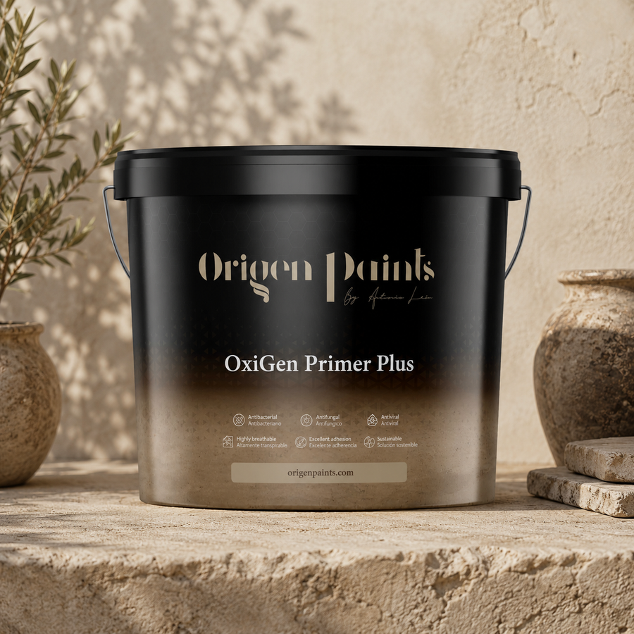 Black container of Origen Paints OxiGen Primer Plus on a stone surface with plants in the background