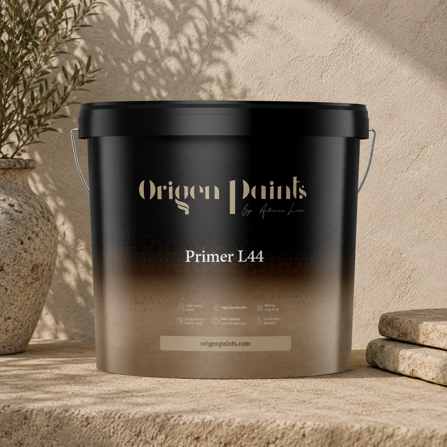 Black paint bucket labeled 'Origen Paints Primer L44' on a stone surface with a neutral background