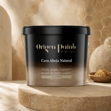 Bucket of Origen Paints Cera Abeja Natural on a stone surface with honeycomb and honey in the background.